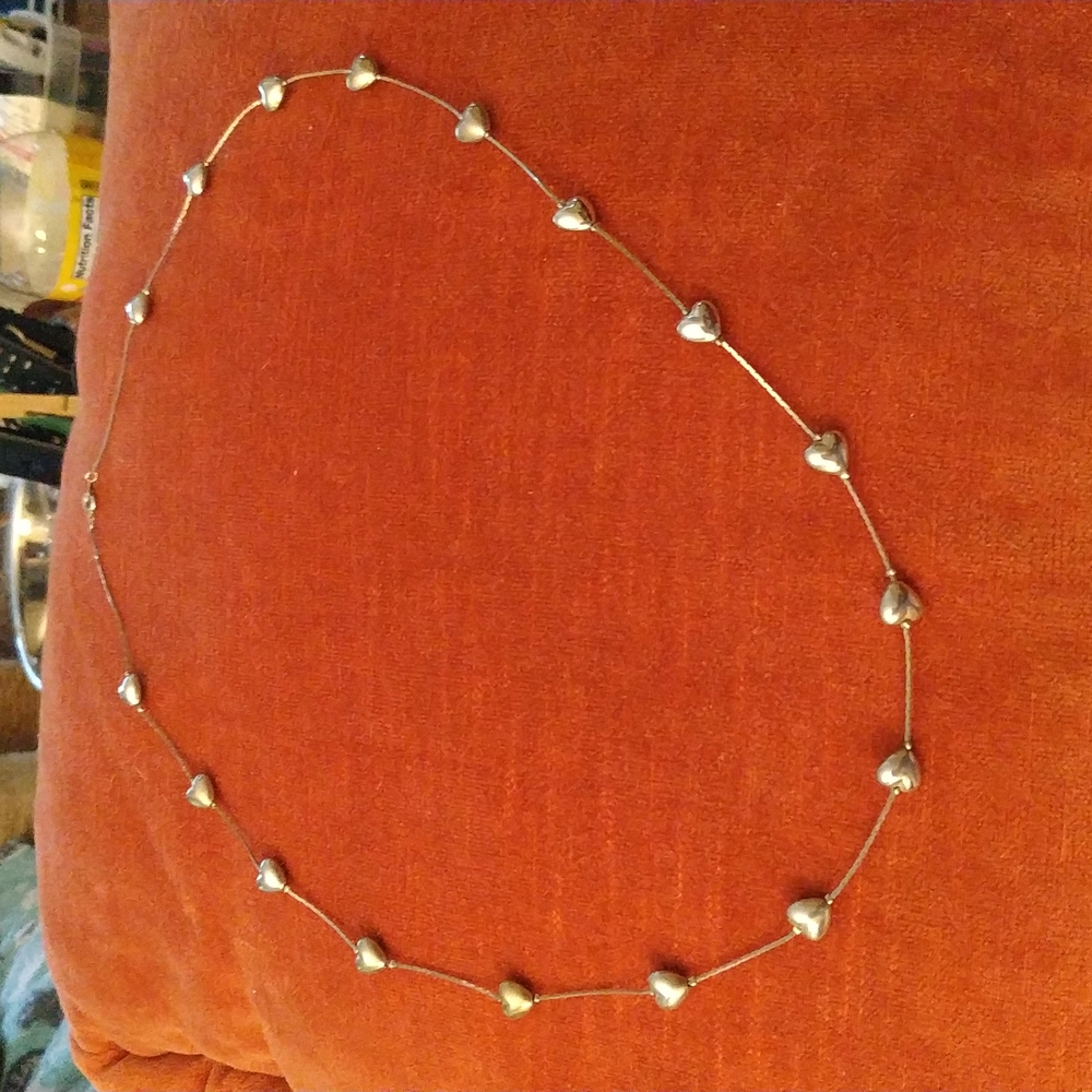 Silver heart necklace...does not stick magnet.